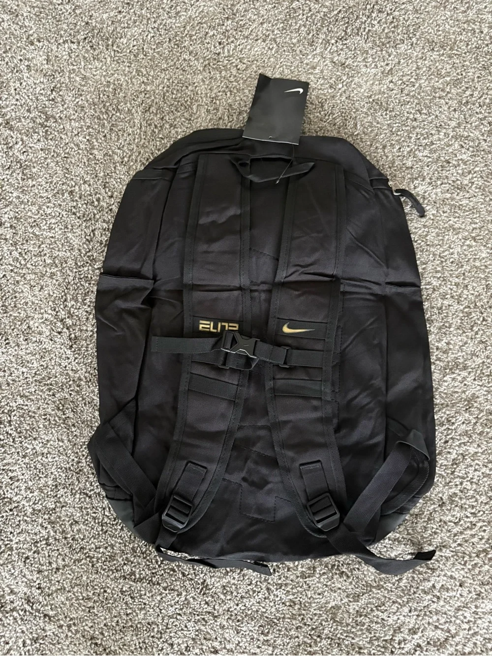 Nike Black Backpack with Gold Stripe and White Swoosh